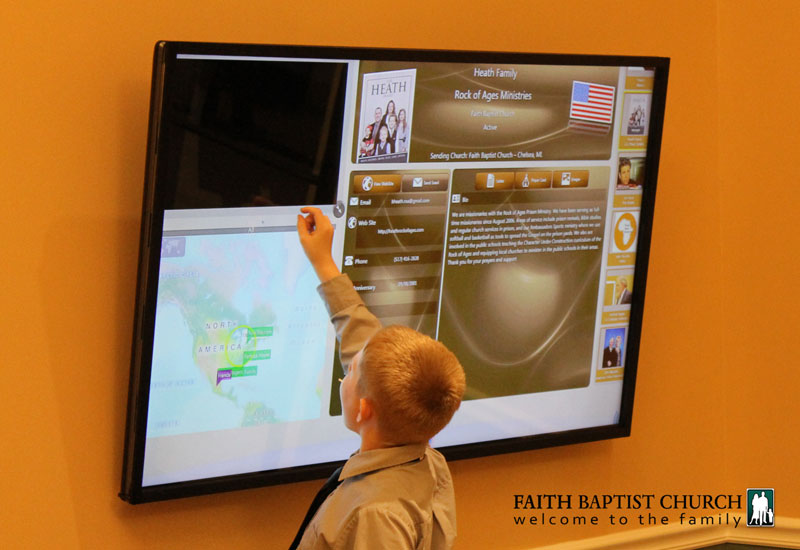 child using missions kiosk example img