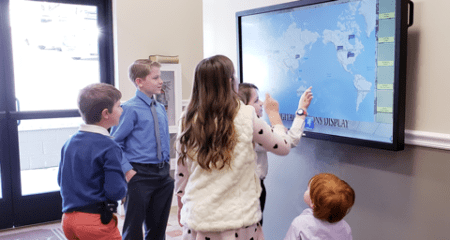 children are using the missions display Digital Mission Display image