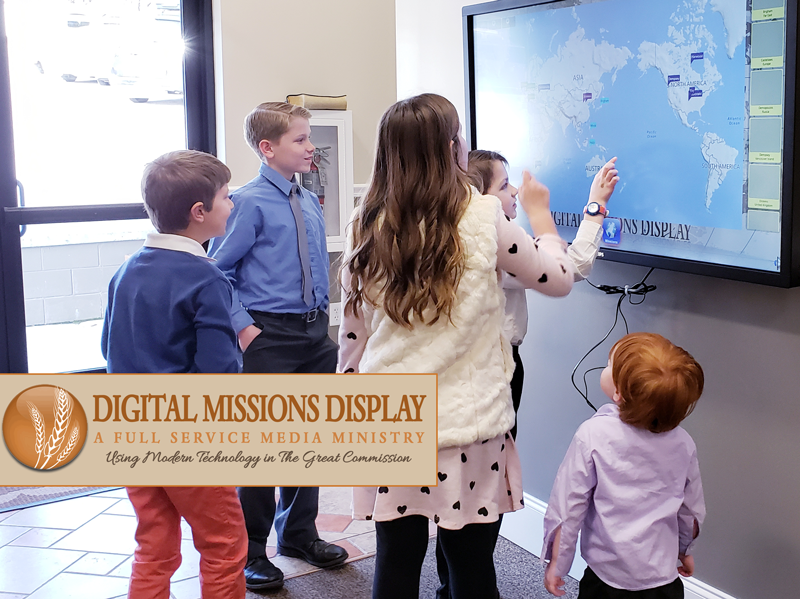 children interacting with mission display at antioch baptist church in knoxville tenessee image