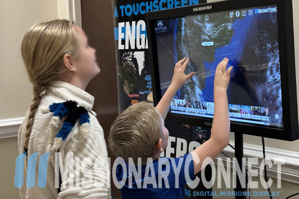 Young people interact with Digital Missions Display image